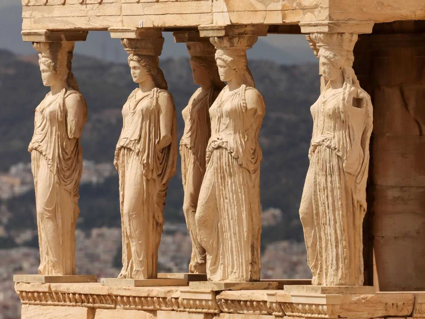Caryatids of the Erechtheion on the Acropolis, with Athens spread out below